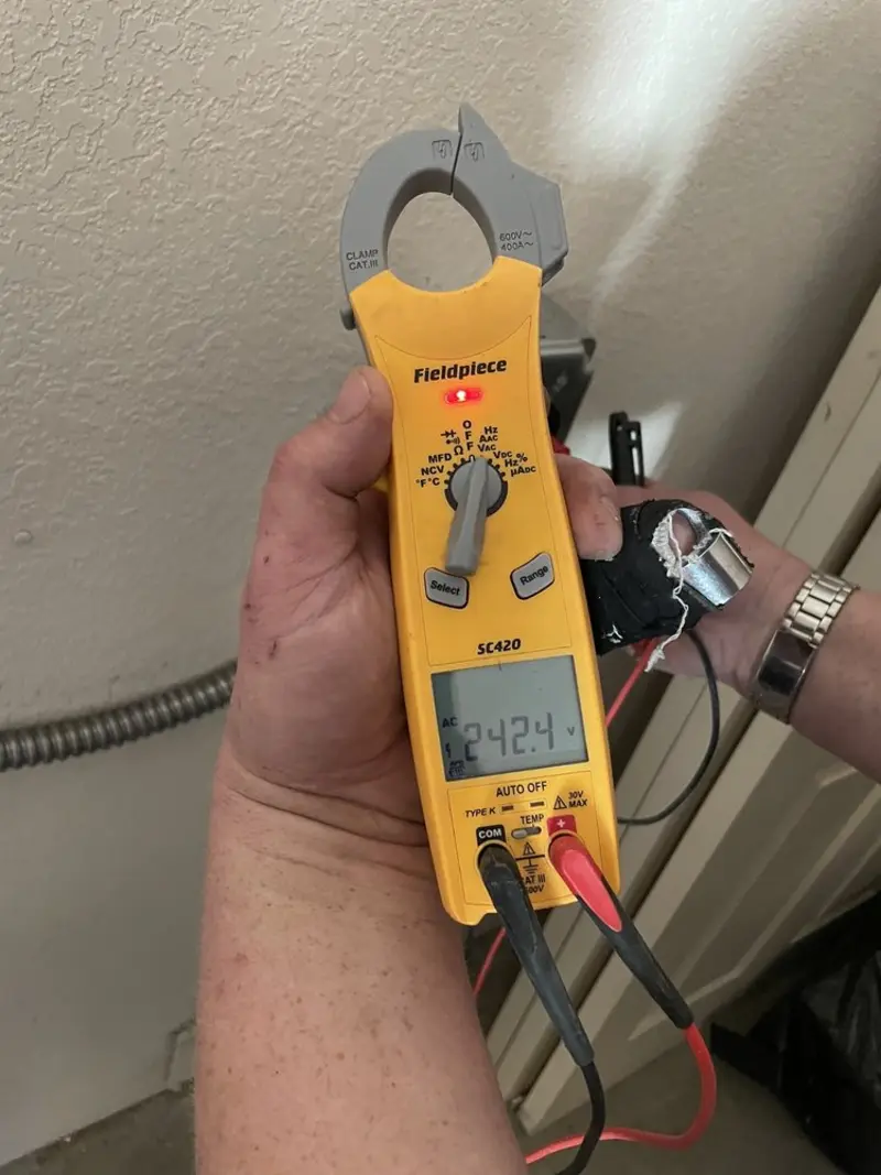 Voltage testing with clamp meter during Ceiling Fan Installation in White Creek